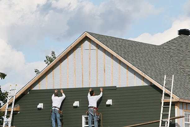 Professional Storm Damage Siding Repair technician working in Petersburg, IL